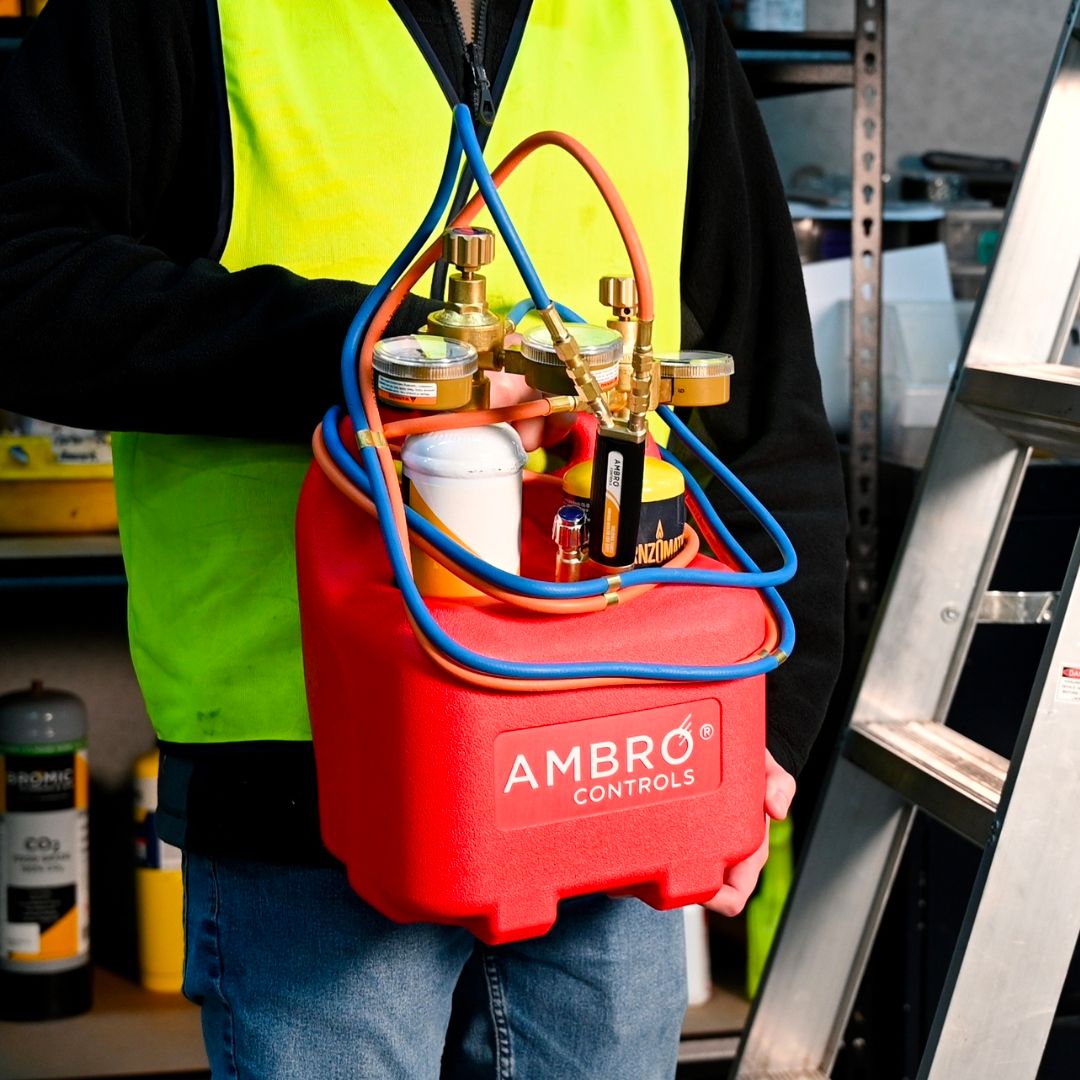 ambro oxyset brazing system being held by a worker