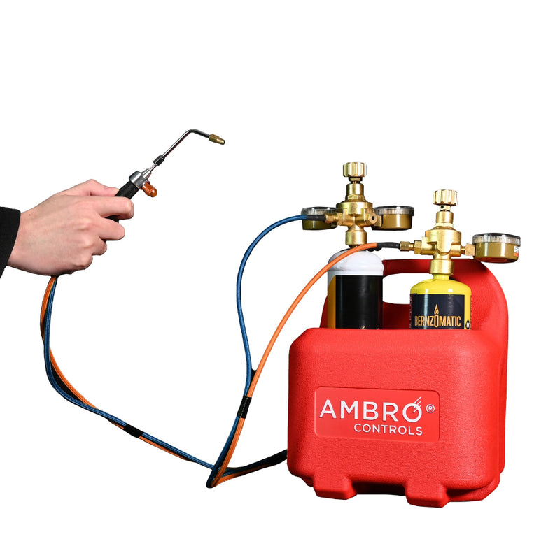 ambro precision torch connected to oxygen cylinders in carrier being held and activated