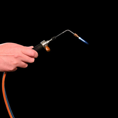 ambro precision torch being held and activated