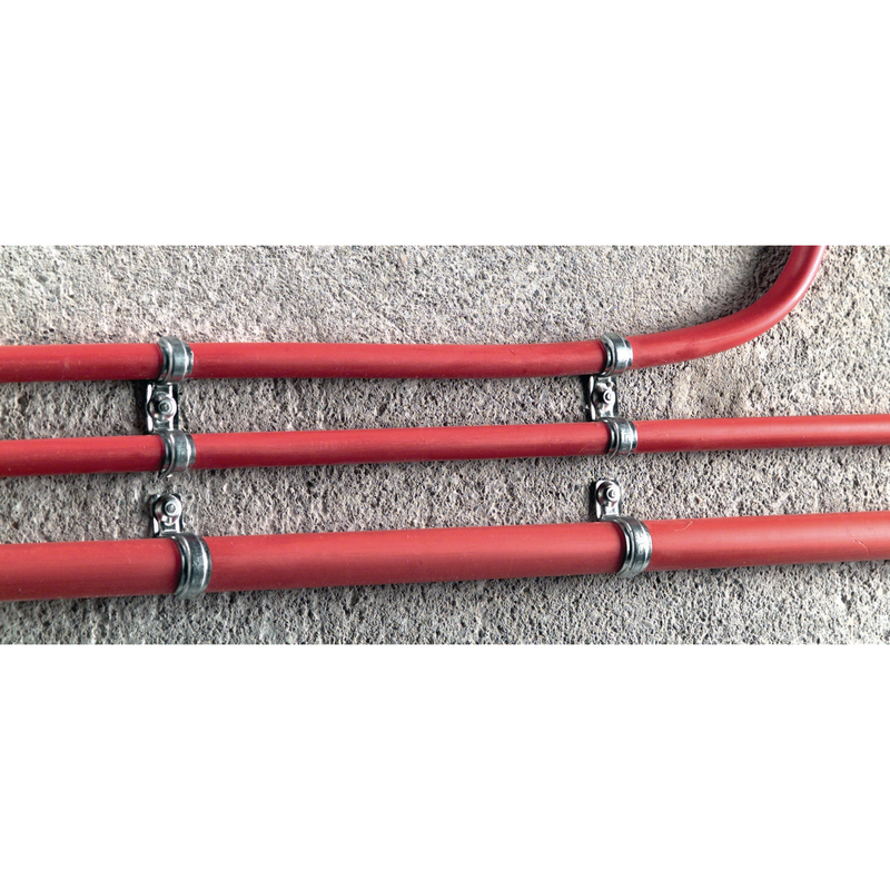 hilti's 1/4" x 3-1/4" masonry screw anchor holding metal bracket around water pipe on concrete wall