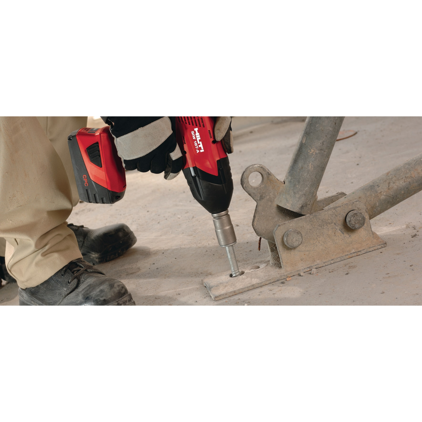 KH-EZ 3/8" x 3" masonry screw anchor being installed to secure steel support in concrete floor