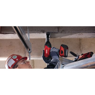 KH-EZ 3/8" x 3" masonry screw anchor being installed to secure steel hangers in concrete ceiling