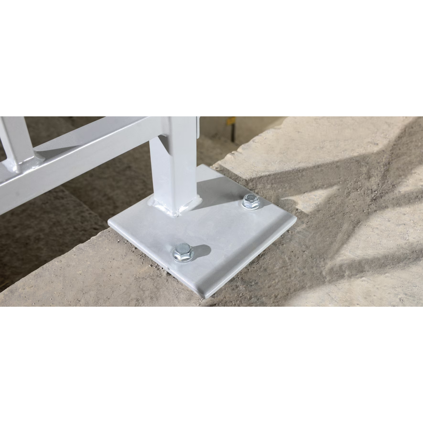 KH-EZ 3/4" x 1-7/8" masonry screw anchor installed to secure steel railing on concrete slab