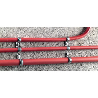 hilti's 1/4" x 1-1/4" masonry screw anchor holding metal bracket around water pipe on concrete wall