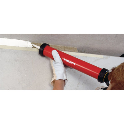 man applying Hilti acrylic firestop caulk