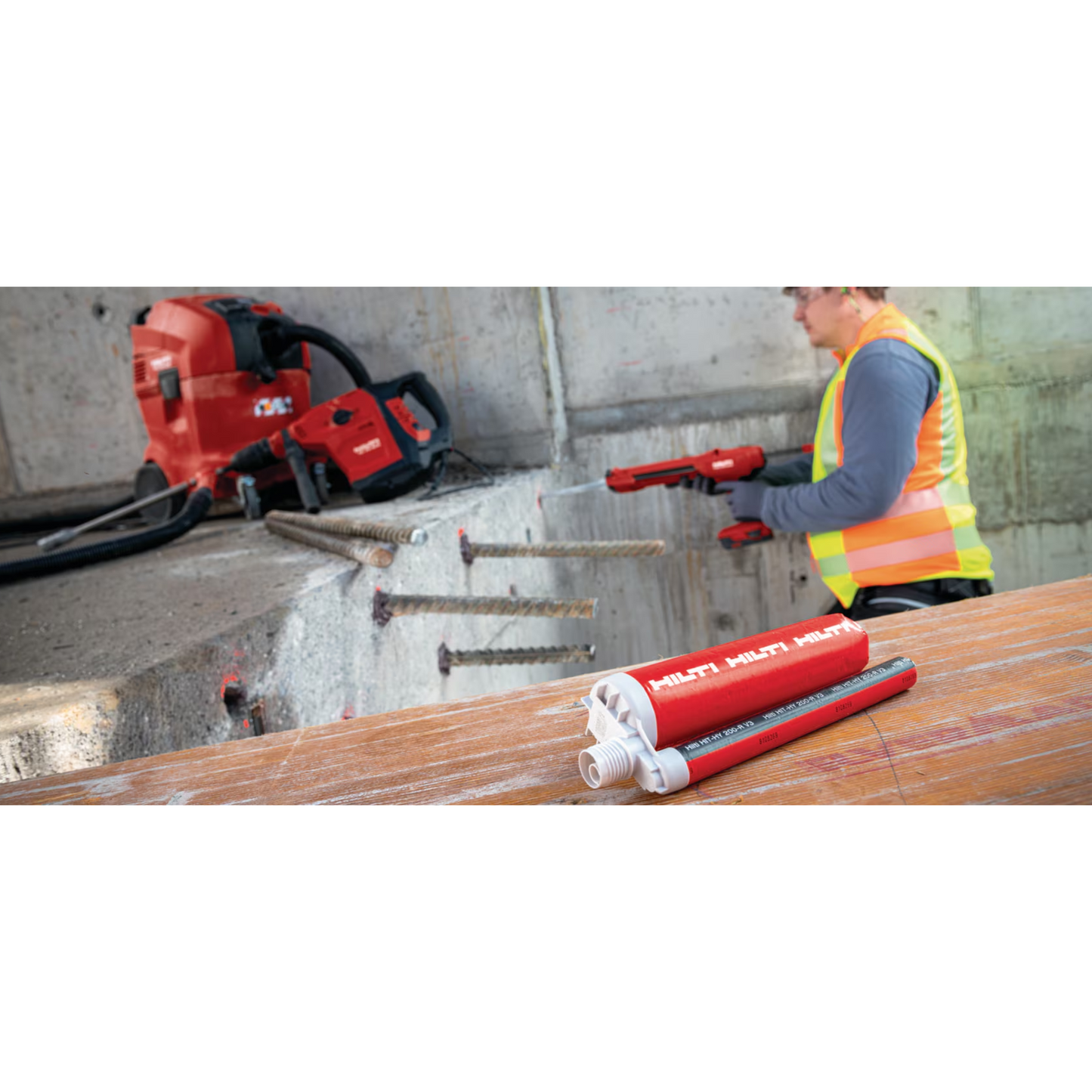 man using hilti's hy 200-r anchoring adhesive to secure rebar into concrete wall