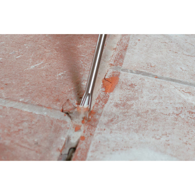 hilti hammer drill bit TE-CX FM 18 being used to remove grout between tiles