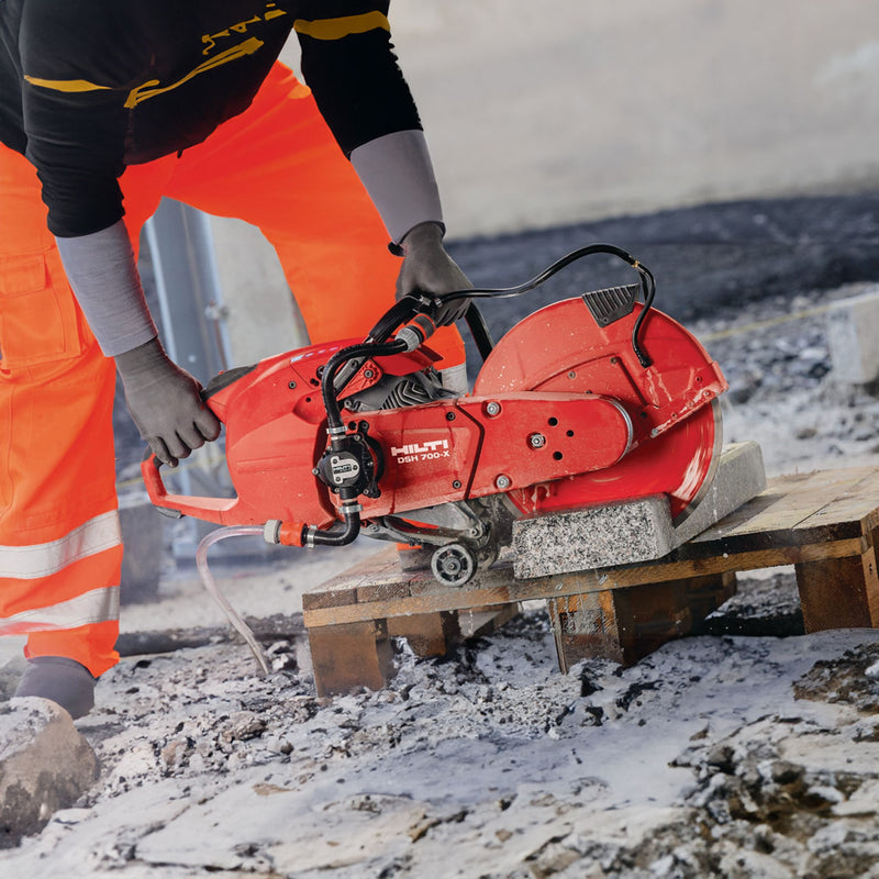 hilti's gas cut-off saw being used to cut pavers