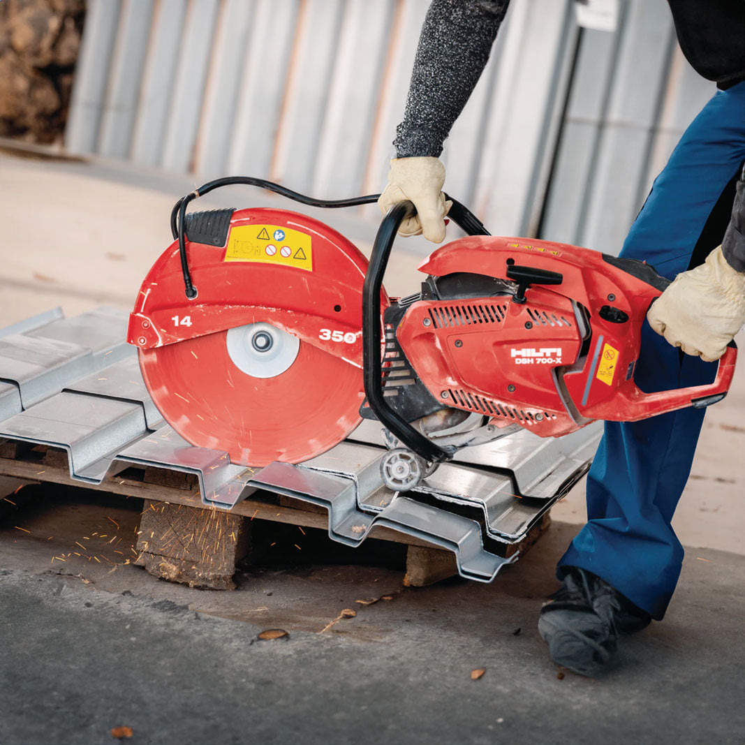 hilti's gas cut-off saw being used to cut corrugated metal sheeting